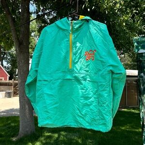 Dutch Bros Teal Pullover Windbreaker quarter zip.